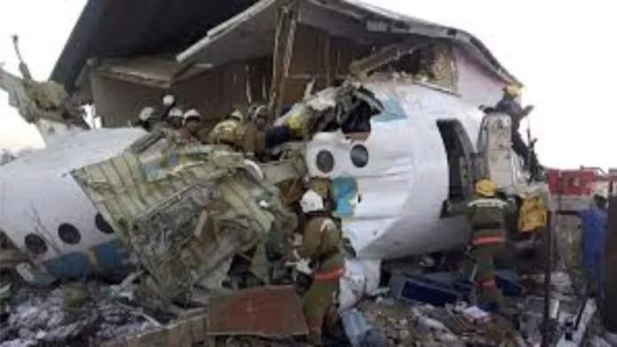 A scene from the crash site in Kazakhstan showing a burning wreckage of an Azerbaijan airplane with debris scattered around, following the crash involving 67 passengers