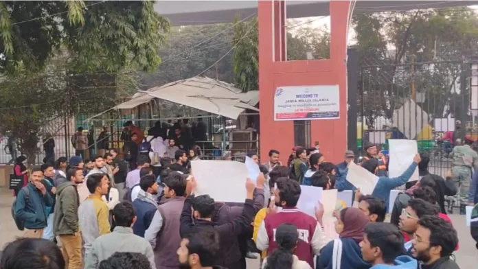 Jamia Millia Islamia students protest, chanting 'Delhi Police Murdaabad' on CAA anniversary.